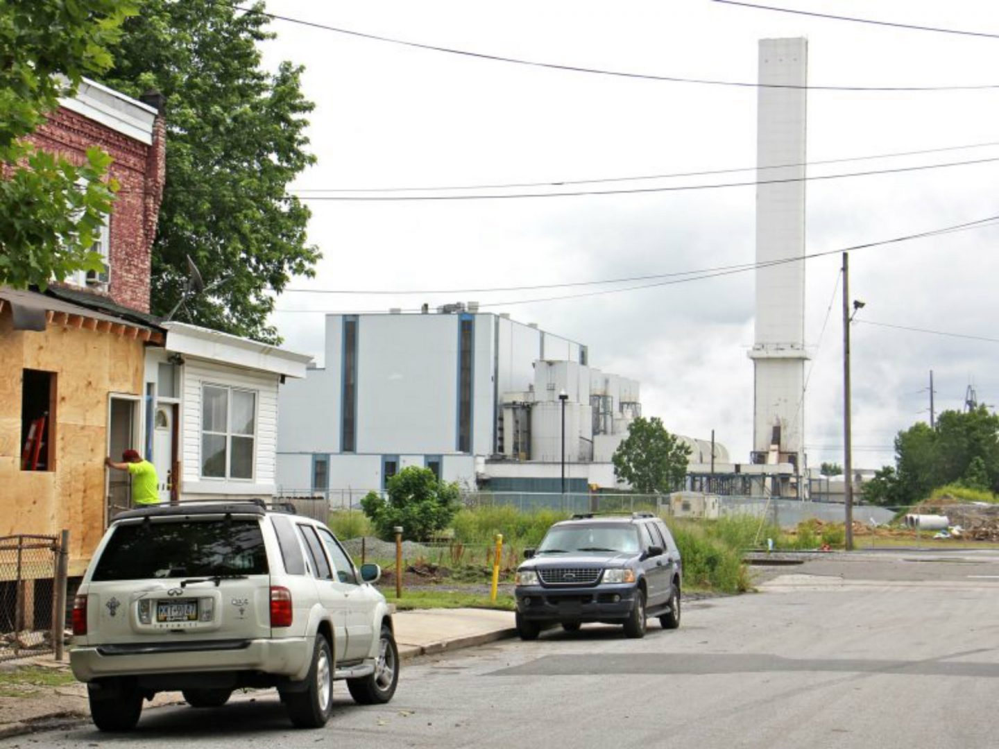 The smokestack of the Delaware Valley Resource Recovery Facility looms over a residential street in Chester.