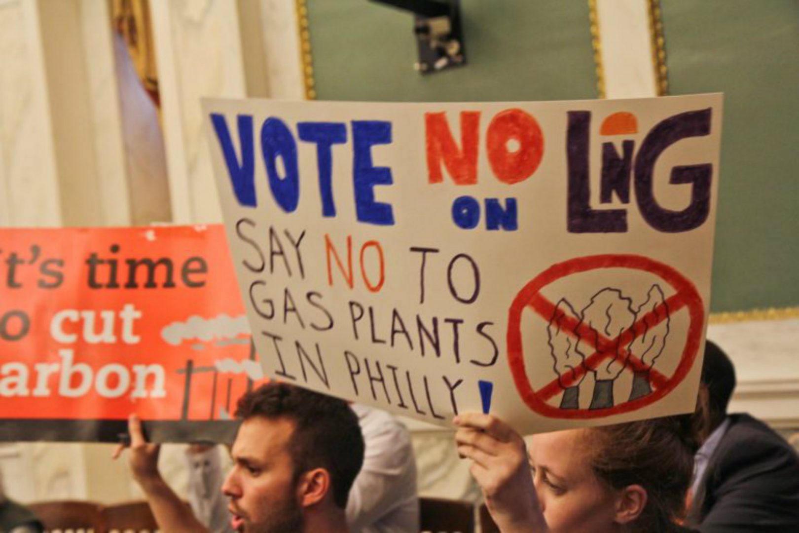 Opposition to the proposed liquefied natural gas plant in Philadelphia protest in city council chambers Thursday. 
