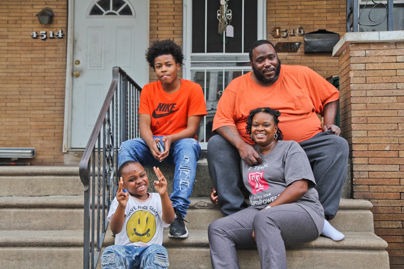Janel Turner, (bottom right), her husband, and two of her sons, at their home in Philadelphia’s Nicetown neighborhood. 