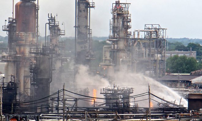 A fire burns at the Philadelphia Energy Solutions refinery hours after a series of early morning explosions at the 150-year-old industrial complex at 3100 W. Passyunk Ave. (Emma Lee/WHYY)