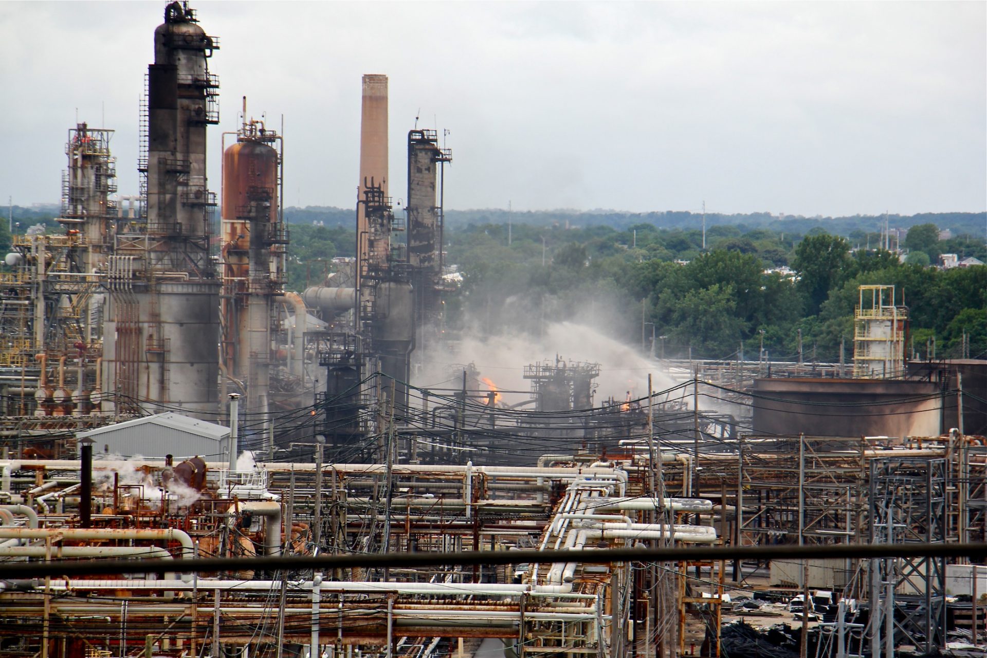 A fire burns at the Philadelphia Energy Solutions refinery hours after a series of early morning explosions at the 150-year-old industrial complex at 3100 W. Passyunk Ave.