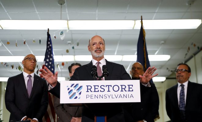 In this March 21, 2019 file photo, Pennsylvania Gov. Tom Wolf speaks during a news conference at the John H. Taggart School library, in Philadelphia. 