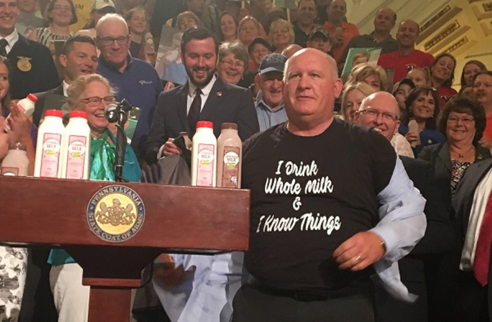 GOP Congressman Glenn Thompson displays his pro-dairy t-shirt to a surprised but appreciative crowd. 