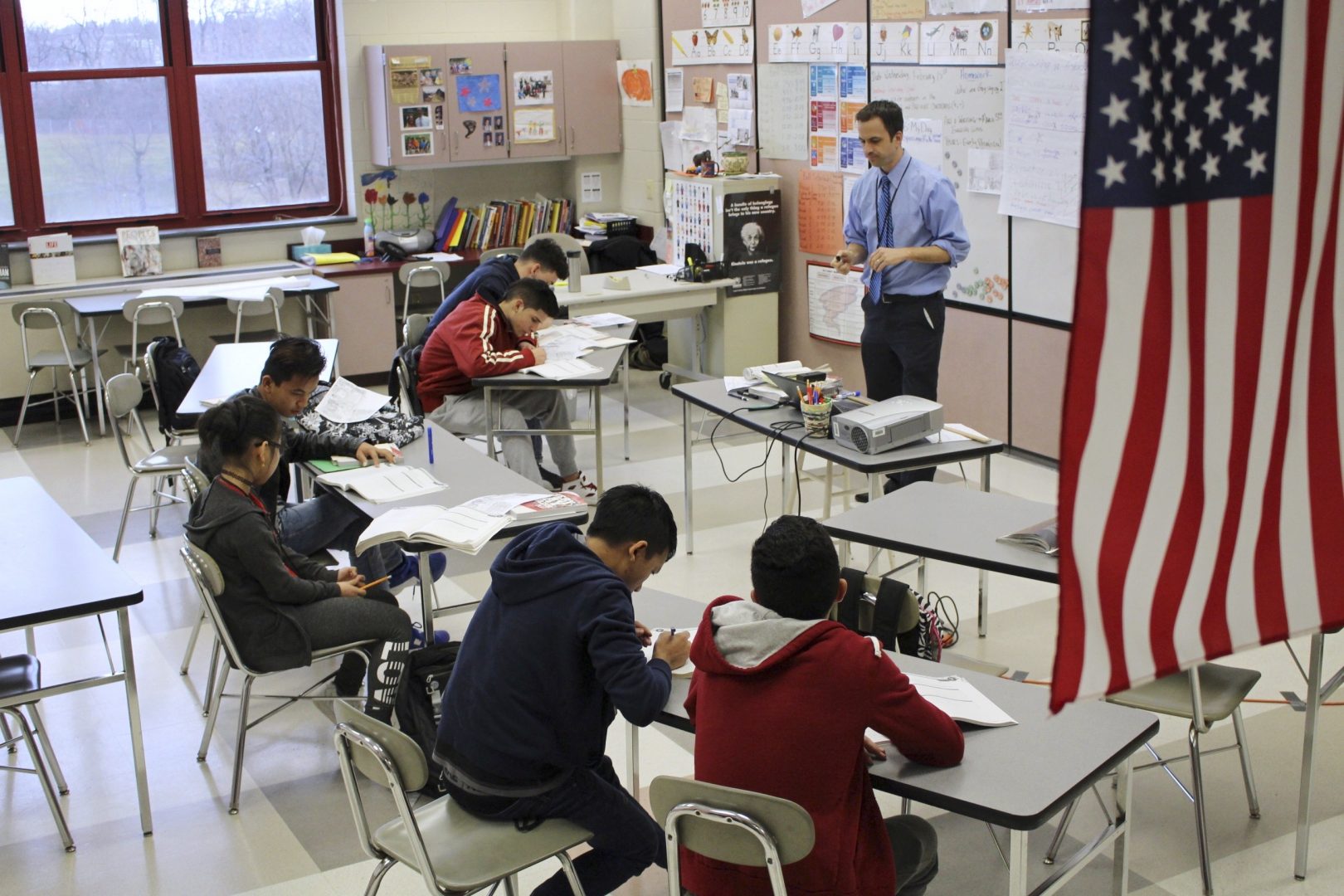 FILE PHOTO: In this Feb. 15, 2017, photo, Eric Hoover teaches his class of immigrant and refugee students at McCaskey High School in Lancaster, Pa. 