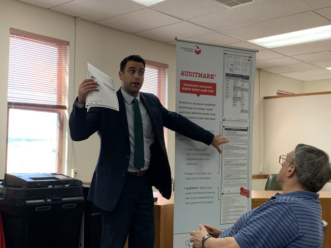 John Hastings, regional sales manager with Dominion Voting Systems, explains how the company's auditing system works to officials in Columbia County June 26, 2019. (Emily Previti, PA Post)