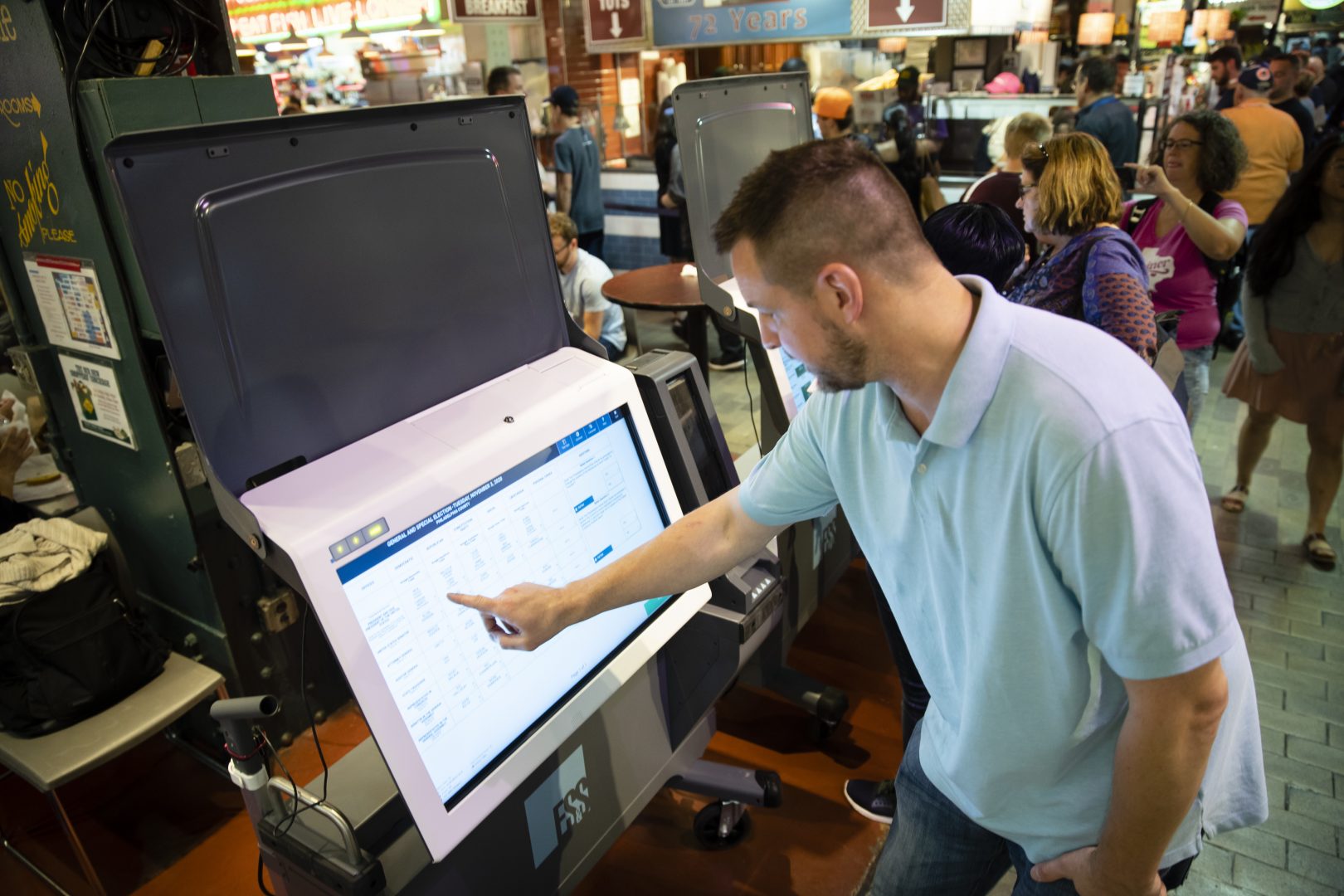 Steve Marcinkus, an Investigator with the Office of the City Commissioners, demonstrates the ExpressVote XL voting machine at the Reading Terminal Market in Philadelphia, Thursday, June 13, 2019.