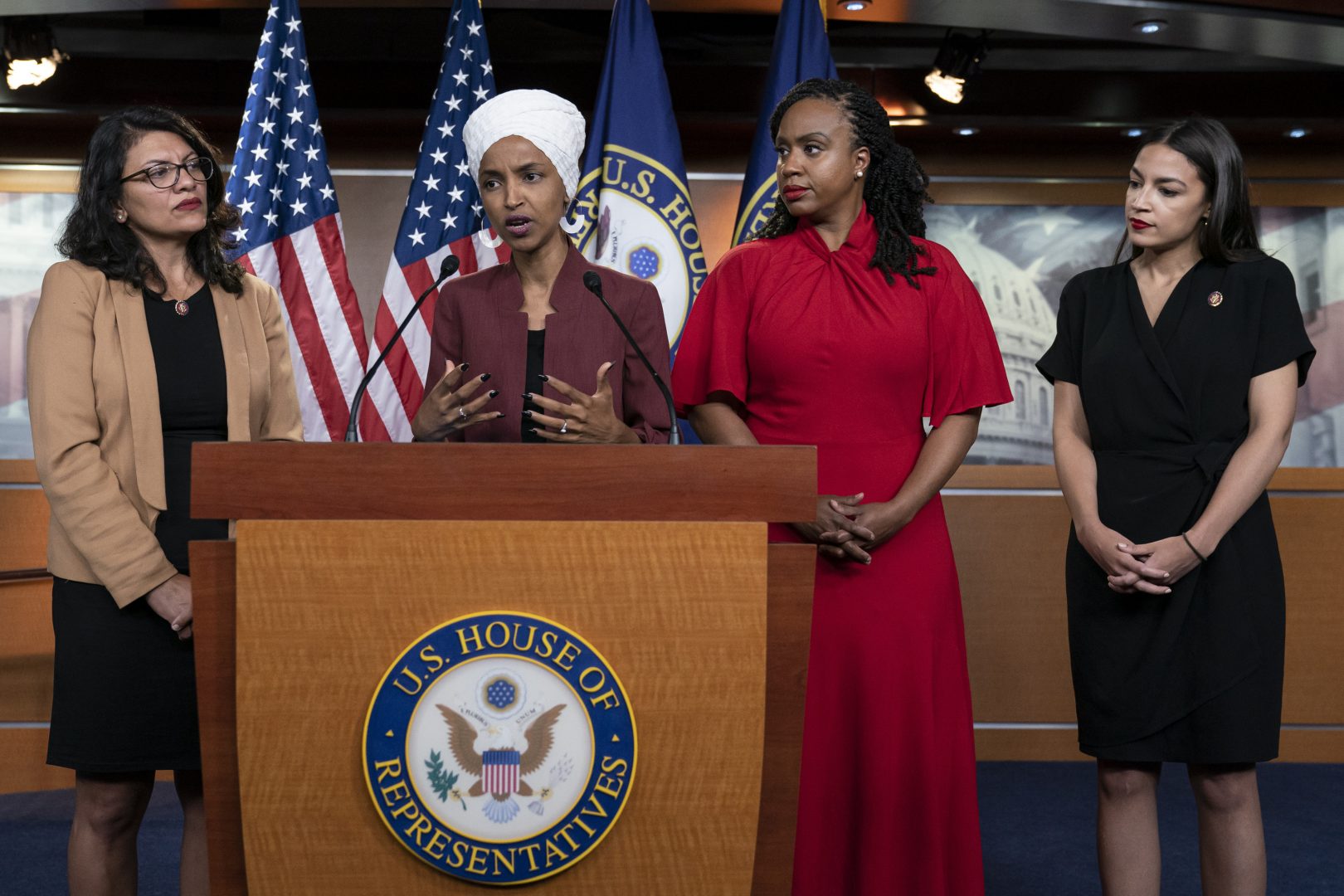  In this Monday, July 15, 2019, file photo, U.S. Rep. Ilhan Omar, D-Minn, second from left, speaks, as U.S. Reps., from left, Rashida Tlaib, D-Mich.,Ayanna Pressley, D-Mass., and Alexandria Ocasio-Cortez, D-N.Y., listen, during a news conference at the Capitol in Washington. 