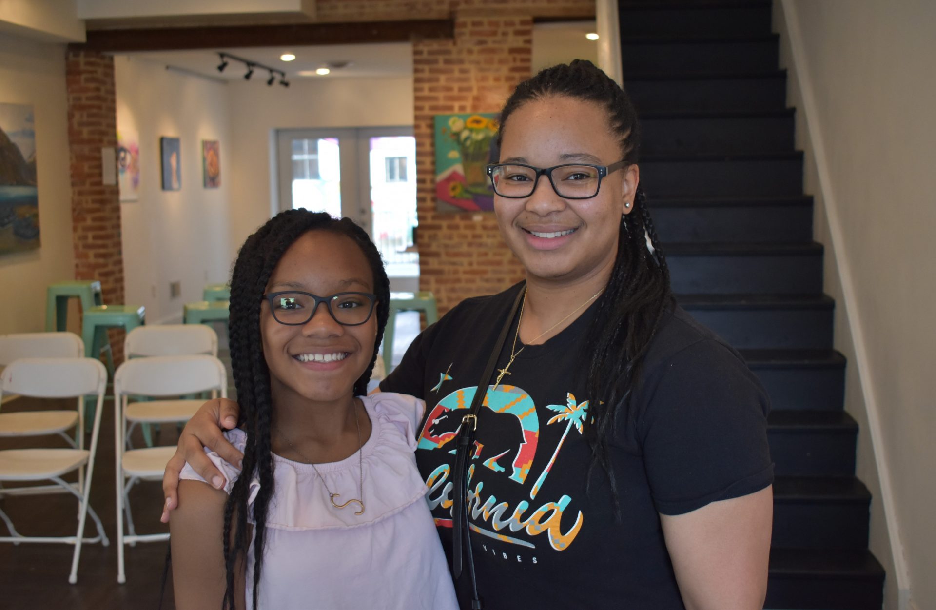 Sayani Stokes, a student at Edgar Fahs Smith STEAM Academy in York, is seen with her mother, Kiesha Jackson, on June 12, 2019, at The The Parliament Arts Organization in York.