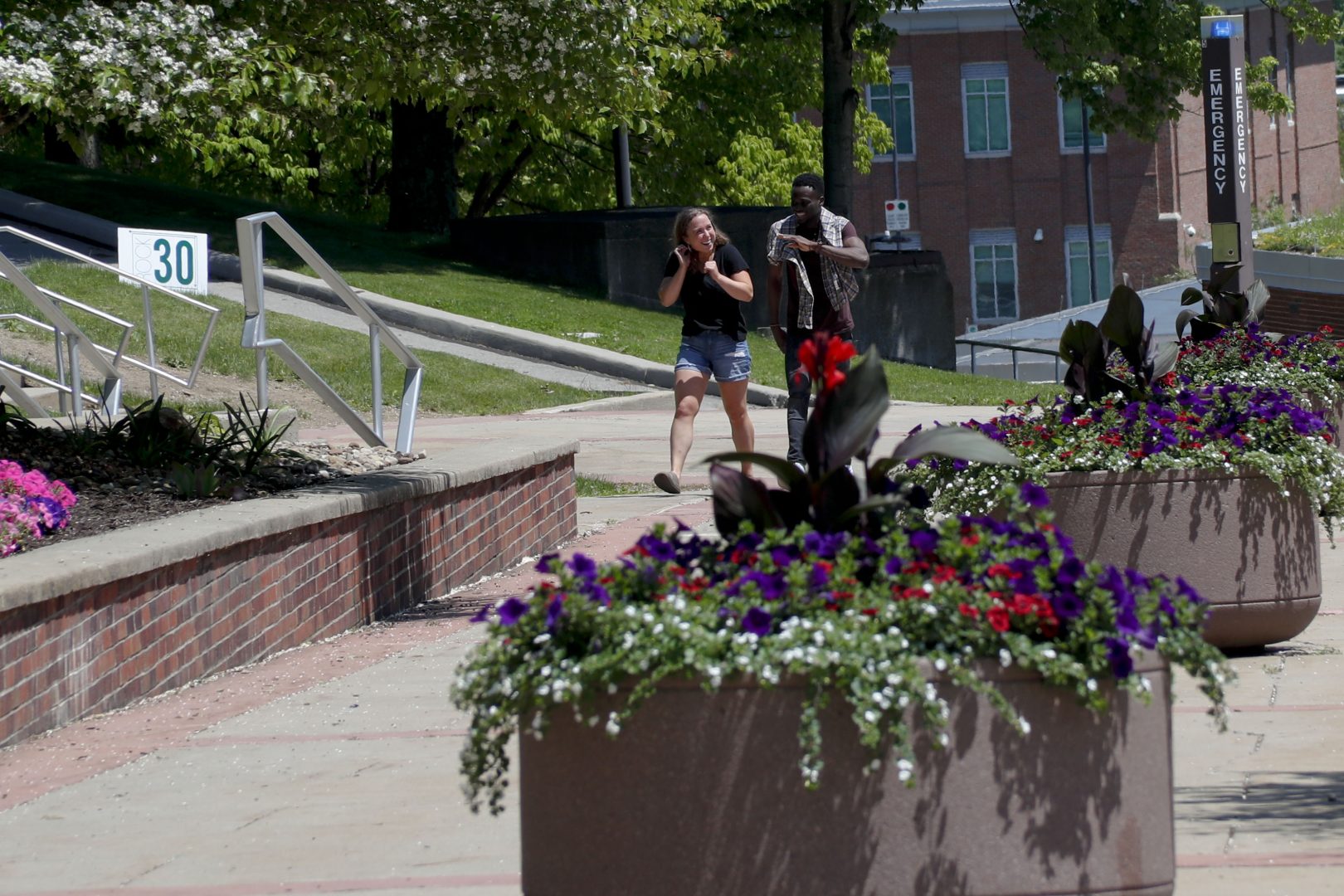 In this photo from Friday, May 24, 2019, visitors walk through the campus of Slippery Rock University in Slippery Rock, Pa. 