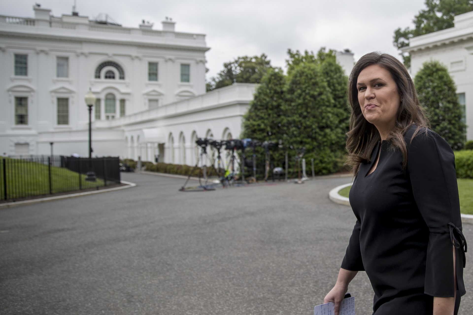 White House press secretary Sarah Huckabee Sanders walks out to Pebble Beach on the North Lawn of the White House, Wednesday, May 8, 2019, in Washington. 