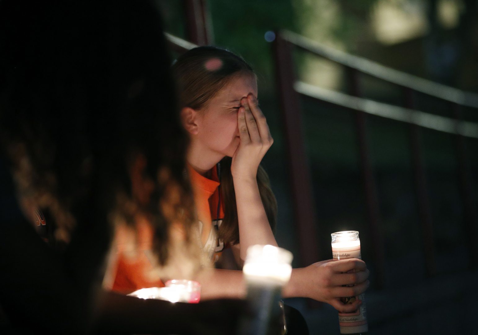 Sherie Gramlich reacts during a vigil for victims of a mass shooting that occurred earlier in the day at a shopping complex Saturday, Aug. 3, 2019, in El Paso, Texas.