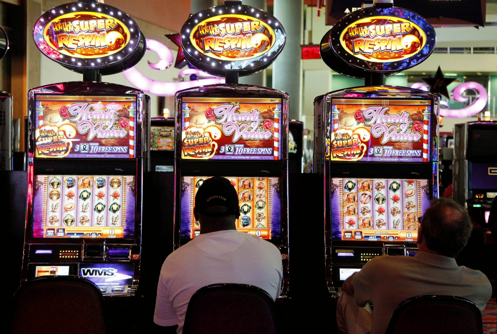 In this May 24, 2012 file photo, patrons play the slot machines at Harrah's Casino in Chester, Pa. 