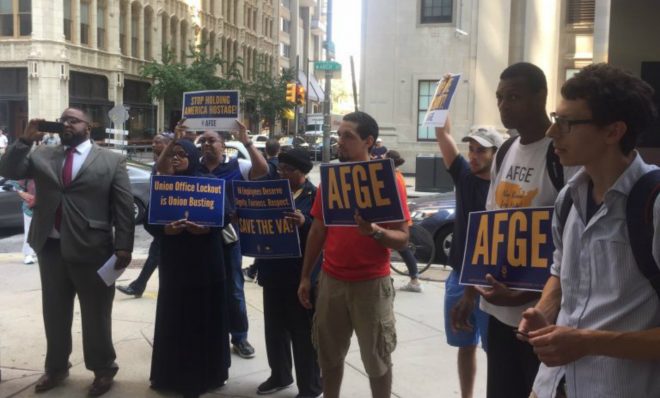 American Federation of Government Employees officials protest the new contract which requires them to vacate their offices in EPA headquarters across the country this week. 