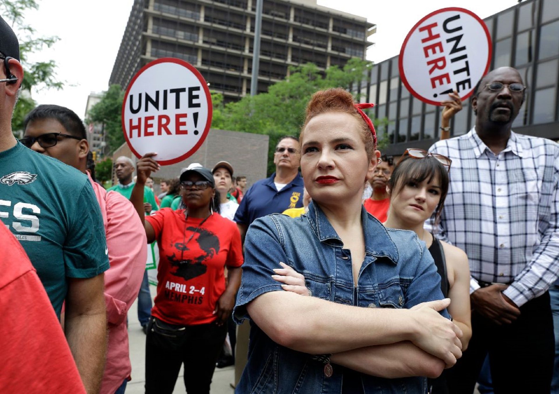 In this June 27, 2018, file photo, Amanda Hammock, center, a Delaware County, Pa. Democratic Party activist, is dressed as Rosie the Riveter during a protest organized by the Philadelphia Council AFL-CIO. The protesters denounced a U.S. Supreme Court ruling that government workers can't be forced to contribute to labor unions that represent them in collective bargaining.