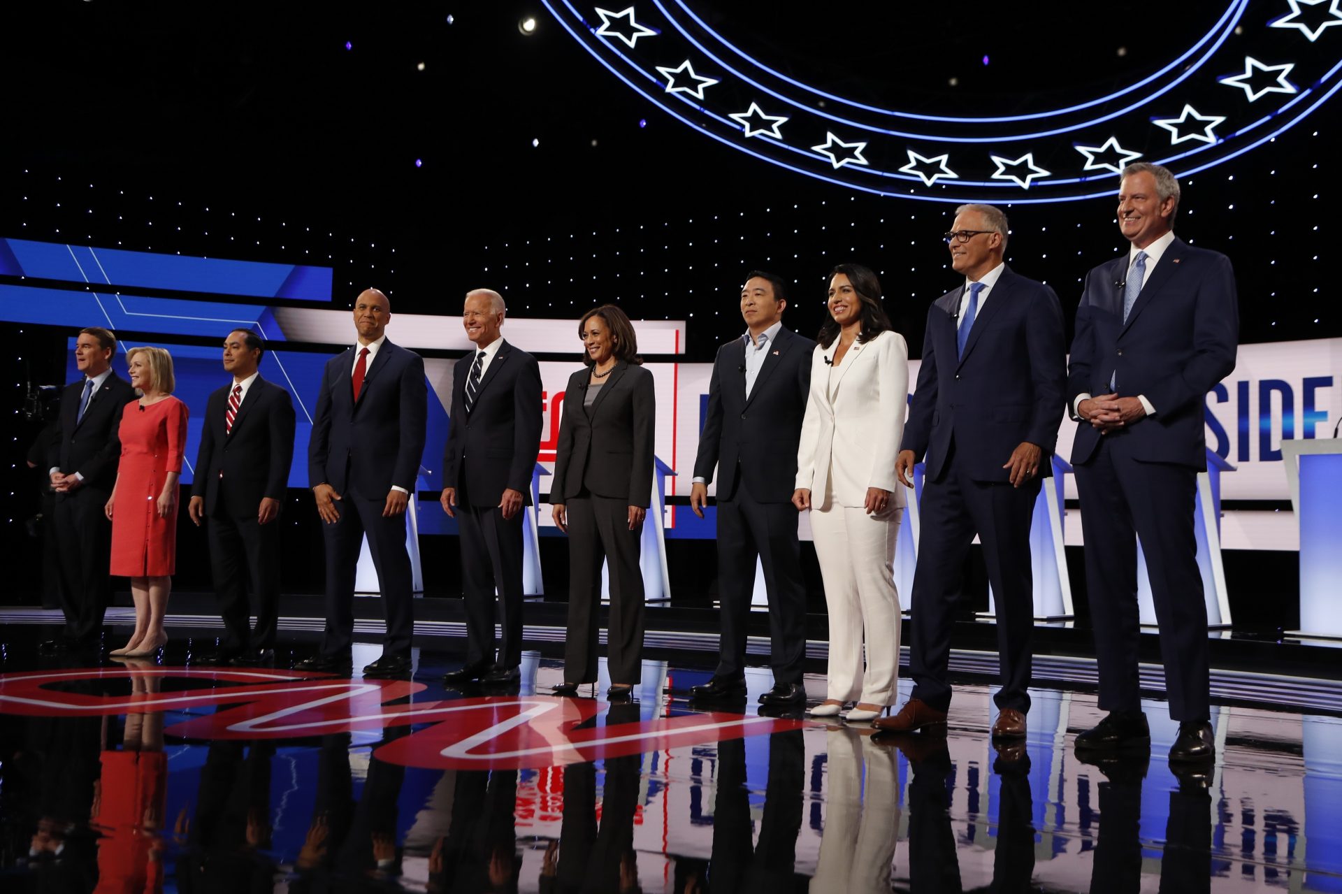 From left, Sen. Michael Bennet, D-Colo., Sen. Kirsten Gillibrand, D-N.Y., former Housing and Urban Development Secretary Julian Castro, Sen. Cory Booker, D-N.J., former Vice President Joe Biden, Sen. Kamala Harris, D-Calif., Andrew Yang, Rep. Tulsi Gabbard, D-Hawaii, Washington Gov. Jay Inslee and New York City Mayor Bill de Blasio are introduced before the second of two Democratic presidential primary debates hosted by CNN Wednesday, July 31, 2019, in the Fox Theatre in Detroit.