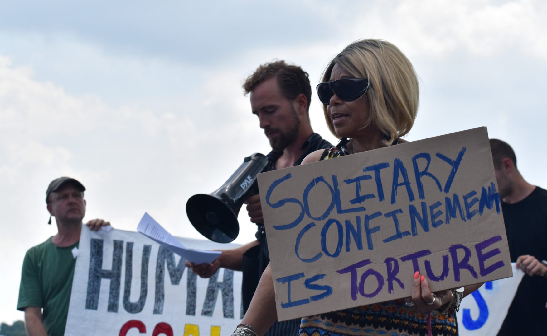 Members of the group Human Rights Coalition speak at a rally Friday, Aug. 2, 2019 at Department of Corrections headquarters in Mechanicsburg, Cumberland County. 