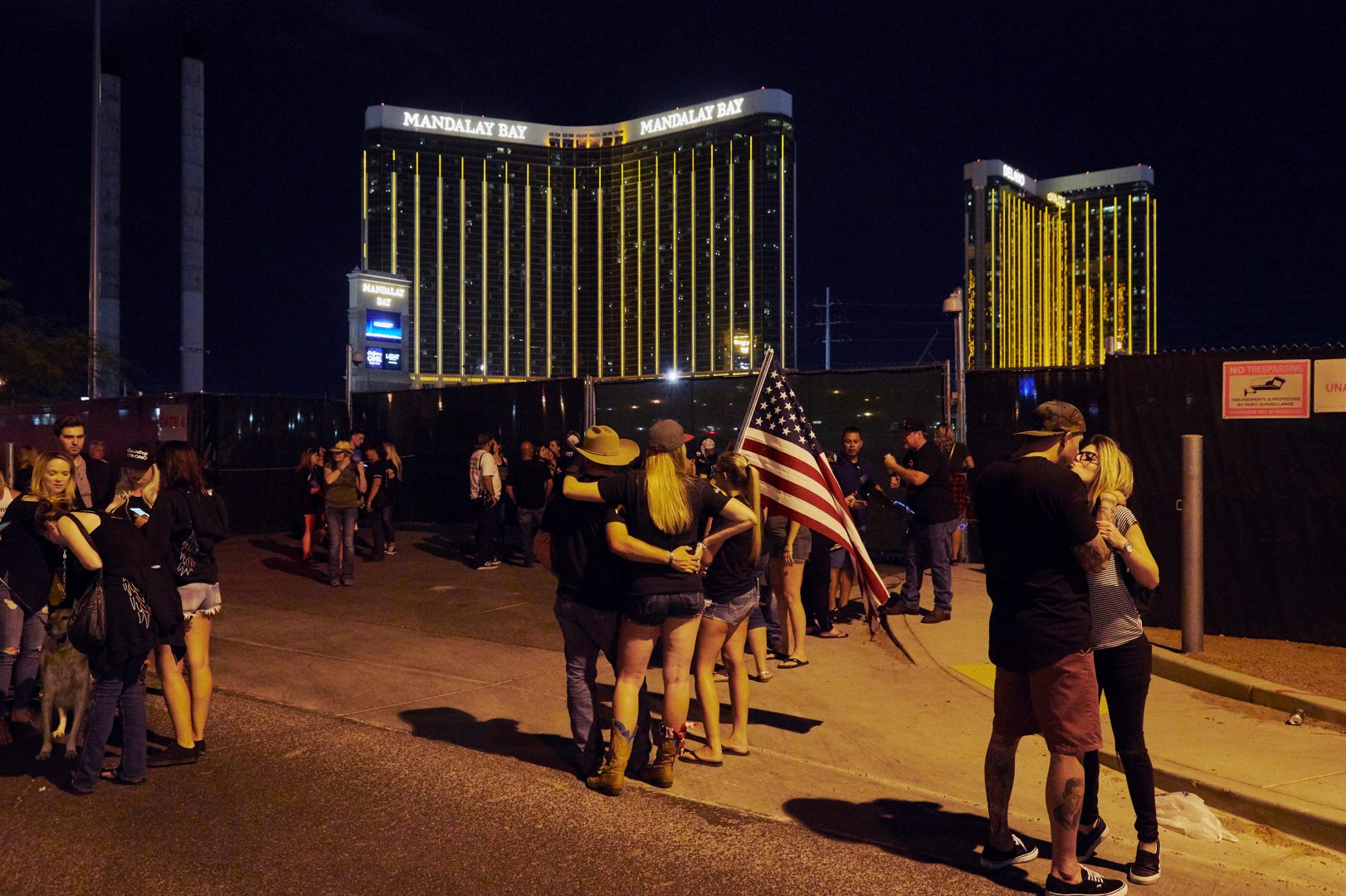 Survivors gather near the Route 91 Harvest festival grounds on Oct. 1, 2018, the first anniversary of the Las Vegas shooting. More than 20,000 people were at the country music festival a year earlier when a gunman opened fire from the Mandalay Bay Resort and Casino.