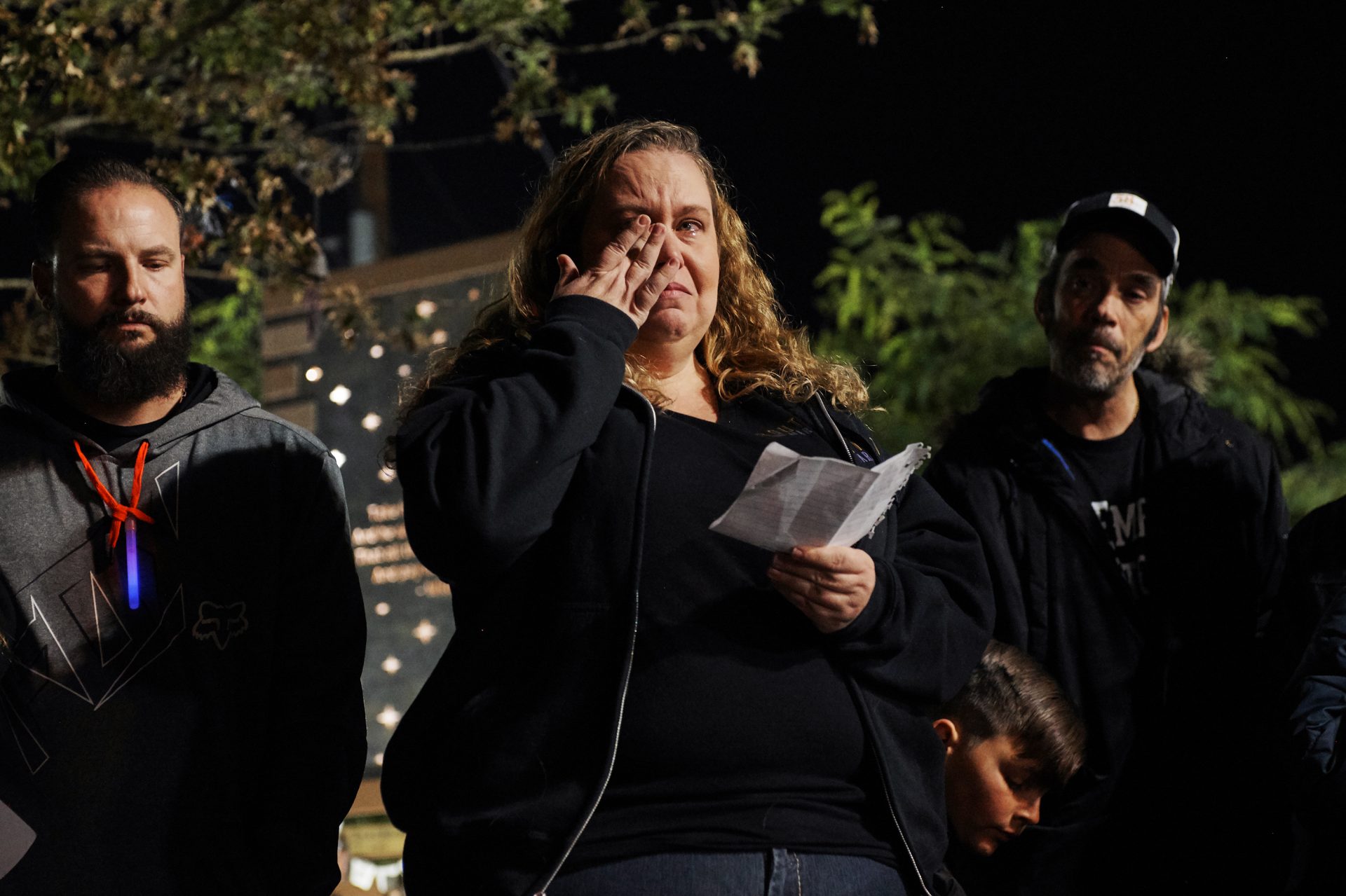 At the Healing Garden in Las Vegas on Nov. 9, 2018, Las Vegas shooting survivor Stacie Armentrout reads the names of victims from the Thousand Oaks, Calif., shooting. One of the people killed in Thousand Oaks was a Route 91 survivor, a friend Armentrout met through the Route 91 community.