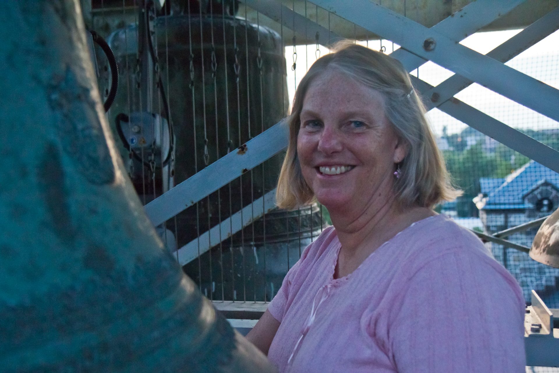 Janet Tebbel poses in the bell tower of the Miraculous Medal Shrine in the Germantown section of Philadelphia.