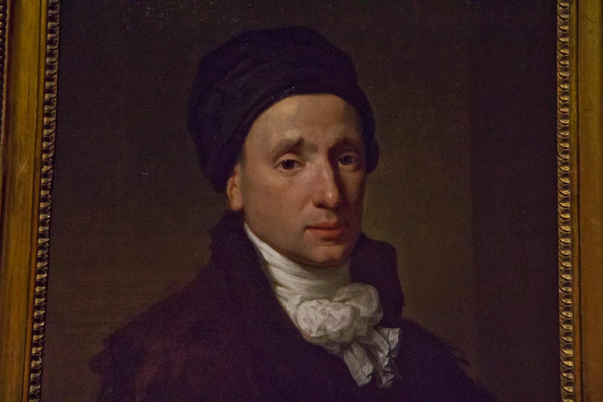 A portrait of Richard St. George painted in his later years when he used a silk hat to hide his head wound.