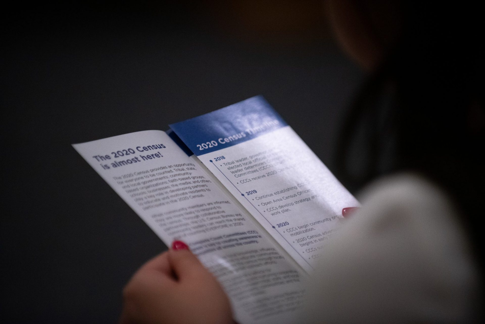 A guest reads information on the 2020 census during a town hall at the University of Pennsylvania on Saturday, Sept. 7, 2019.