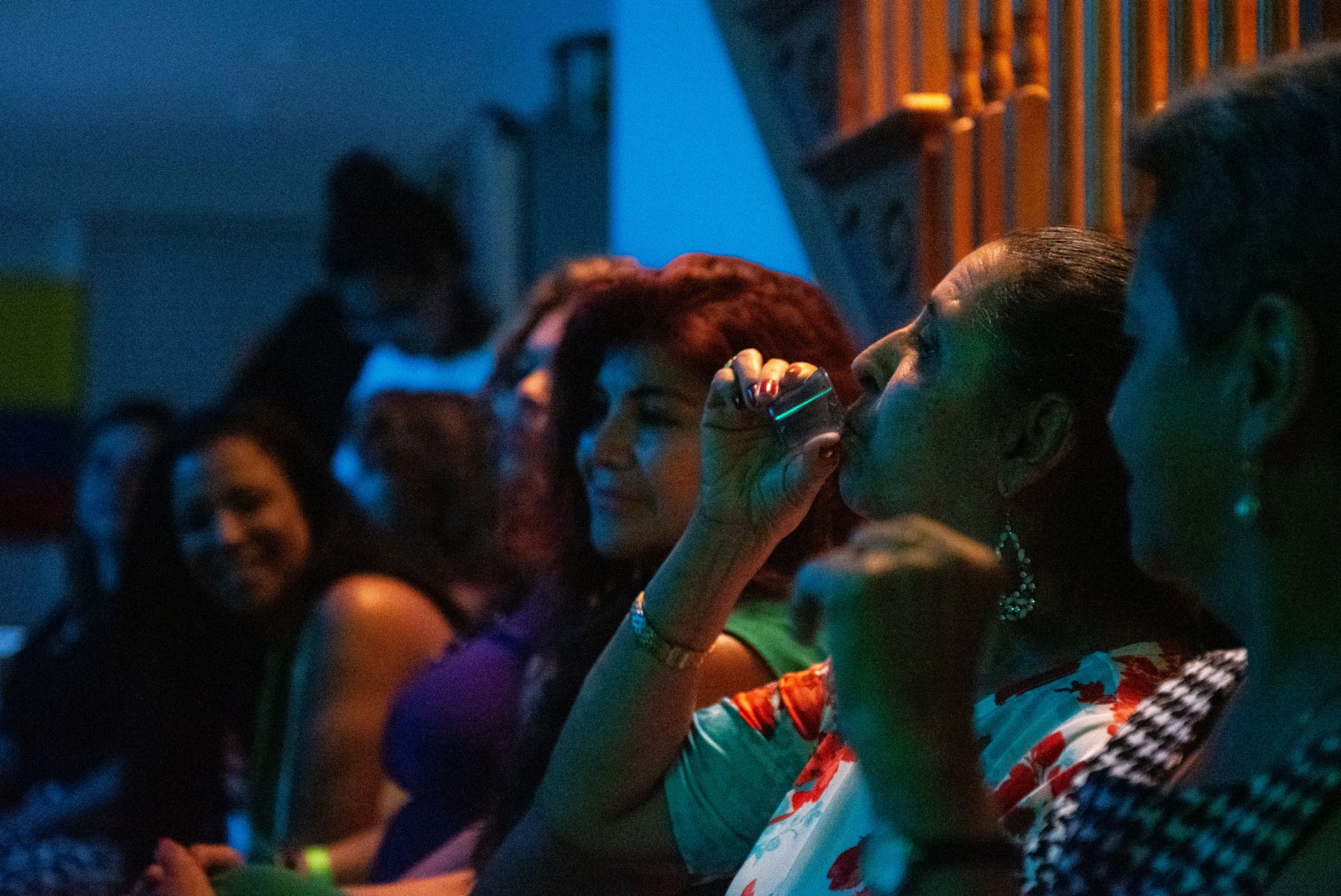 Mariela Bedoya takes a shot of tequilla during the vijoteca in Oxford Circle on Saturday, September 14, 2019.