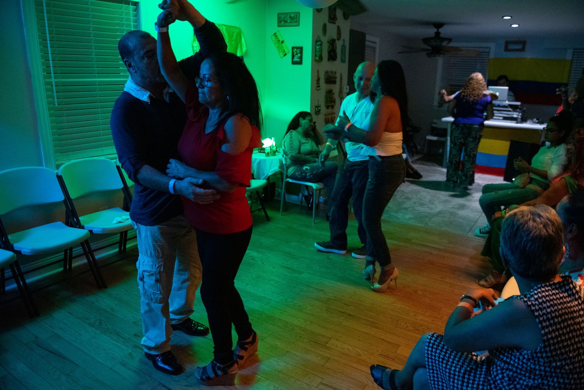 Guests dance in a viejoteca held in an Oxford Circle home on Sunday, September 15, 2019.