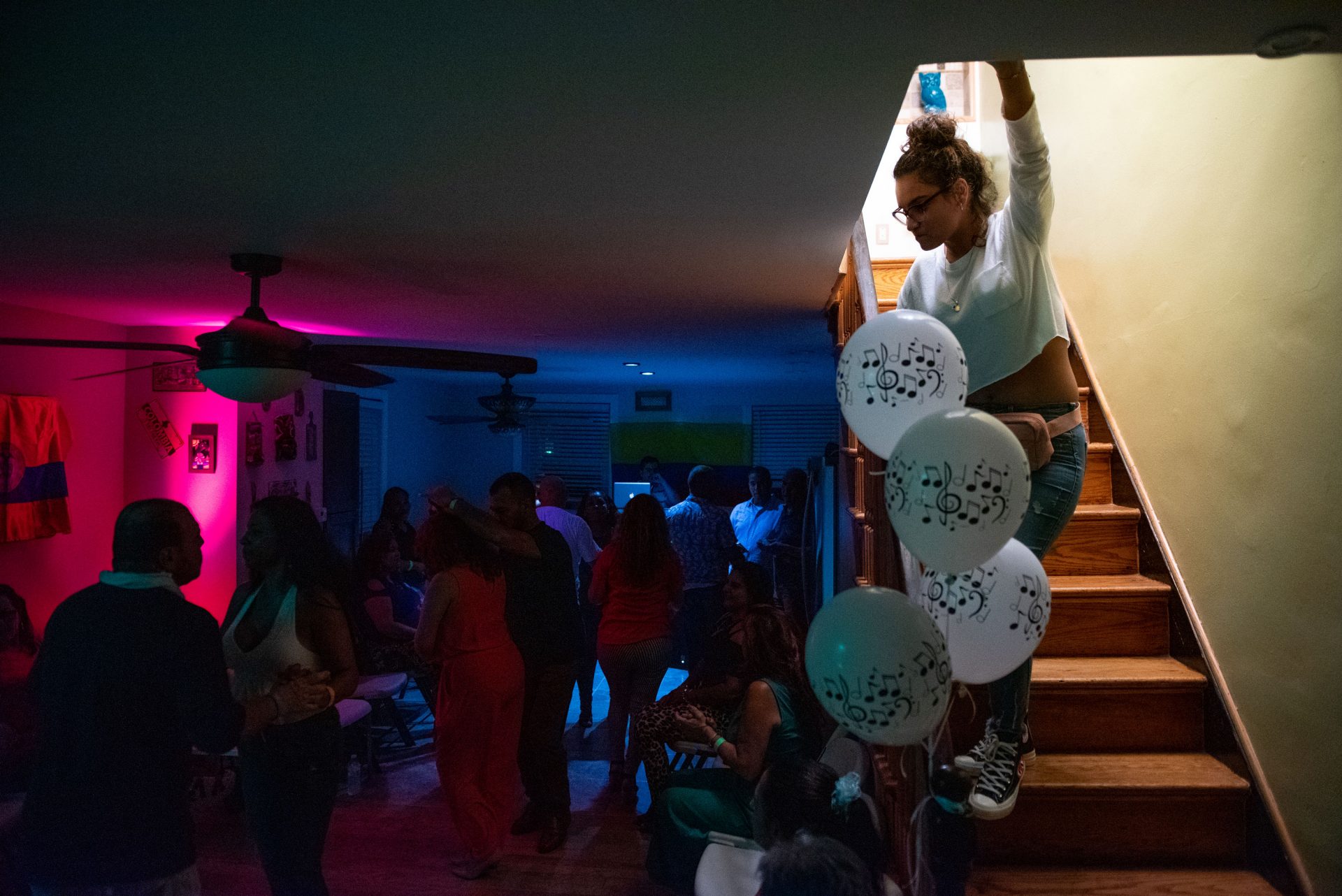 Sandra Colon laughs while dancing in the living room of her Oxford Circle home on Sunday, September 15, 2019. Colon regularly turns her home into a viejoteca (a dance party for older adults) after one restaurant in Philadelphia that hosted them closed down.