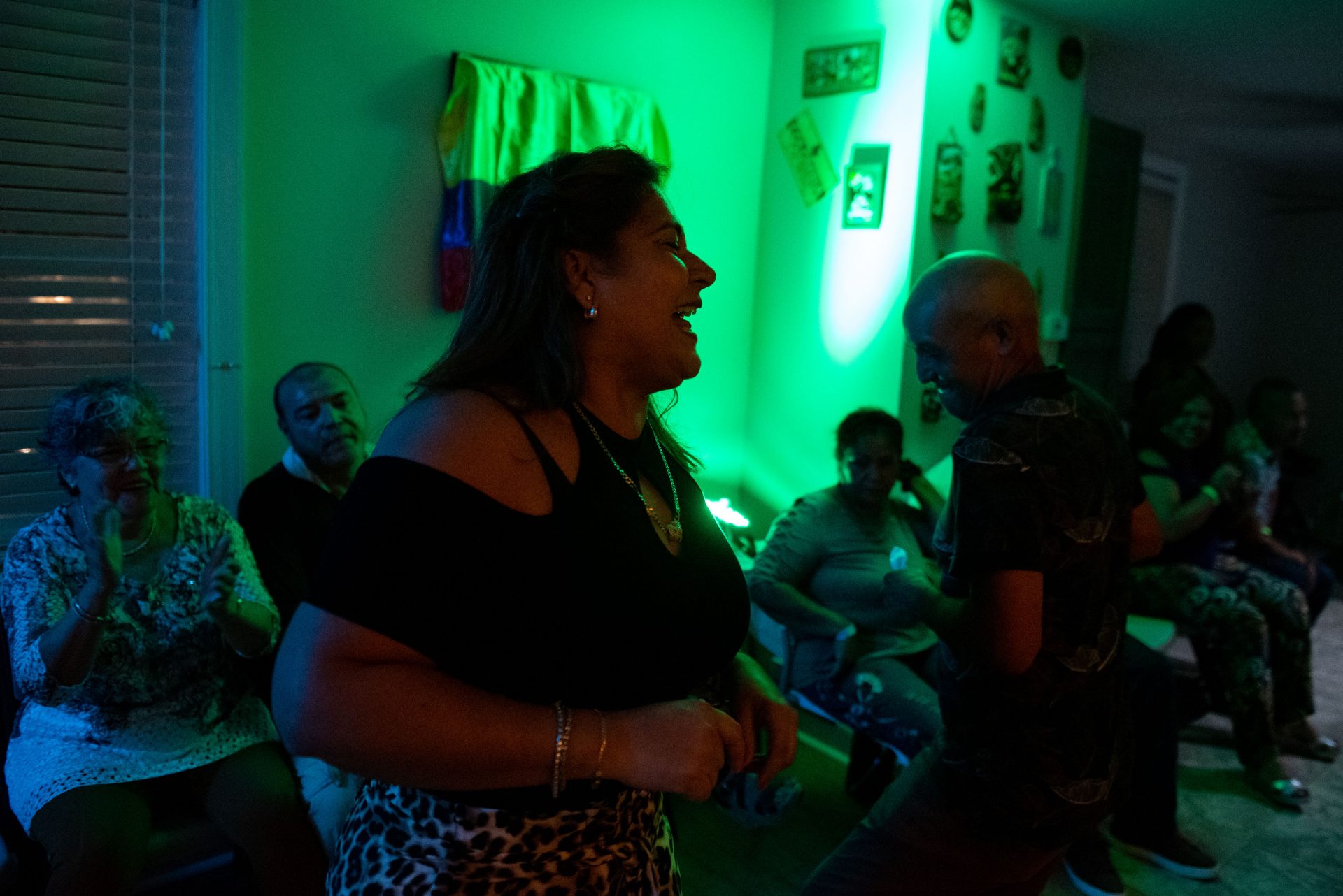 Einar Victoria is seen dancing with Liliana Acero through the front entrance of an Oxford Circle home-turned-viejoteca on Sunday, September 15, 2019.