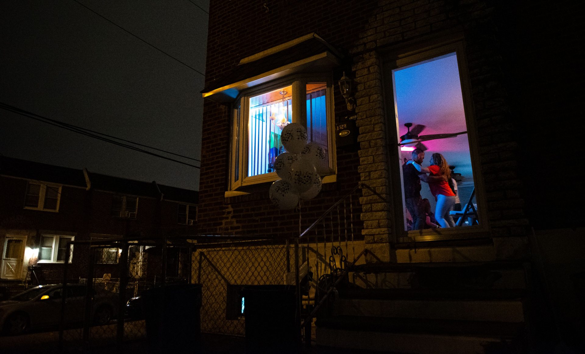 Einar Victoria is seen dancing with Liliana Acero through the front entrance of an Oxford Circle home-turned-viejoteca on Sunday, September 15, 2019.