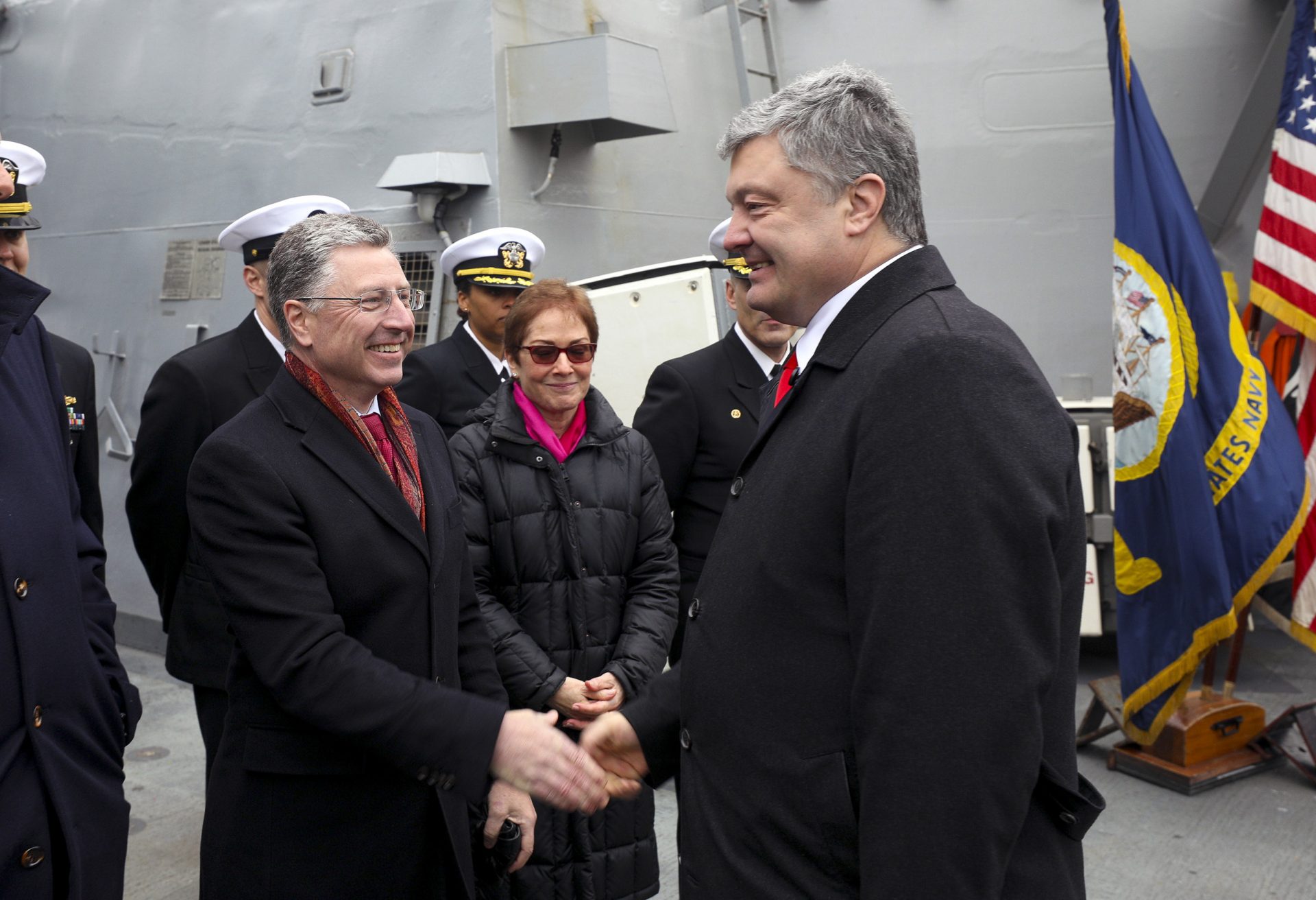 Ukraine's President Petro Poroshenko, right, shakes hands with US Special Representative for Ukraine Kurt Volker as he visited the US Navy destroyer Donald Cook in Odessa, Ukraine, Tuesday, Feb. 26, 2019.