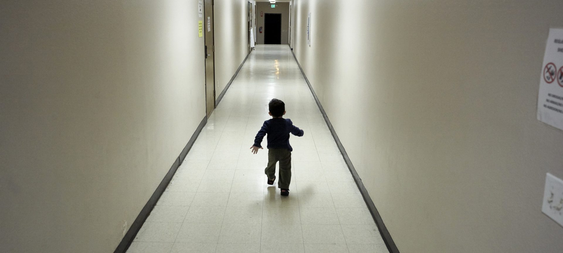 In this Dec. 11, 2018 file photo, an asylum-seeking boy from Central America runs down a hallway after arriving from an immigration detention center to a shelter in San Diego.