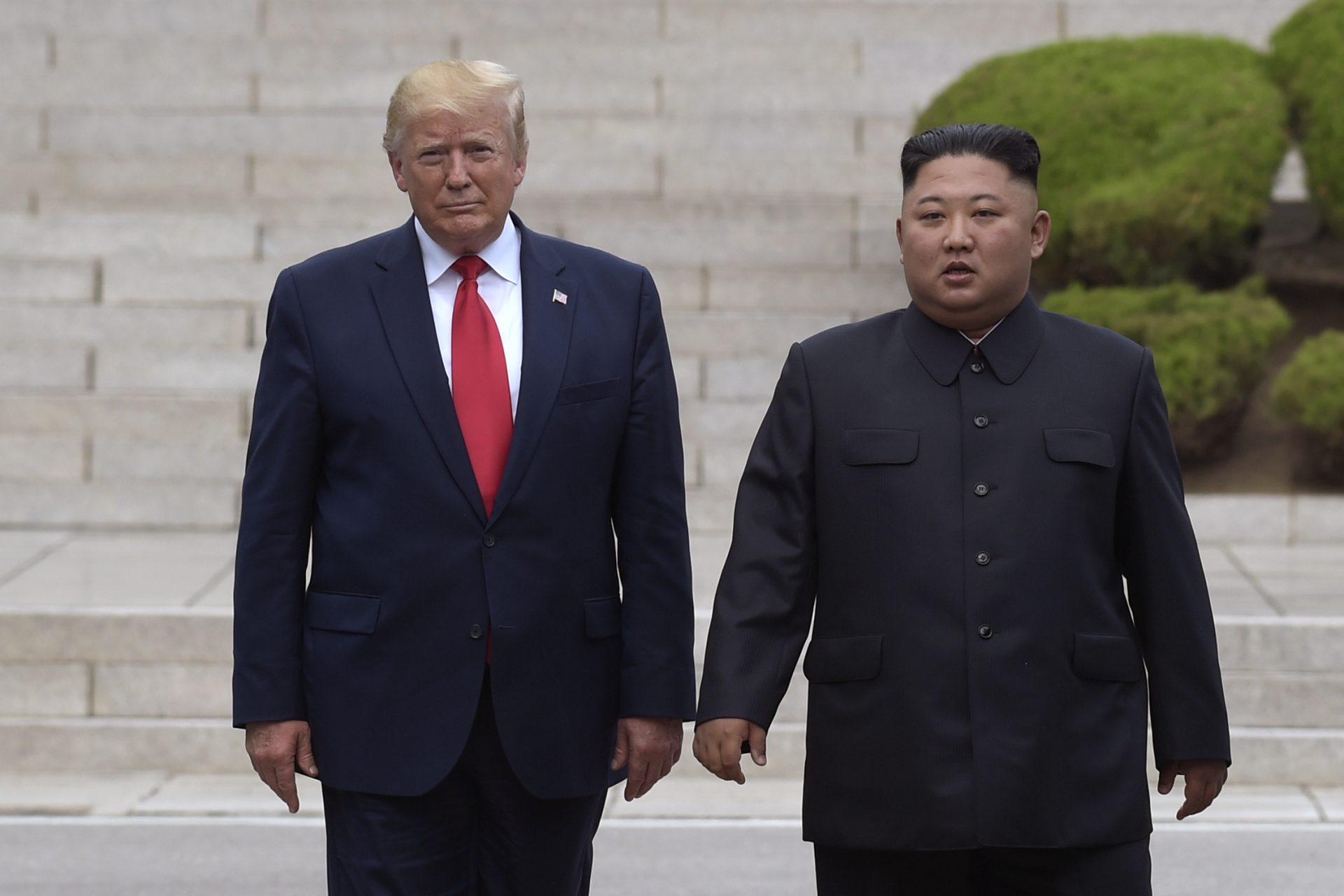 President Donald Trump, left, meets with North Korean leader Kim Jong Un at the North Korean side of the border at the village of Panmunjom in Demilitarized Zone, Sunday, June 30, 2019.