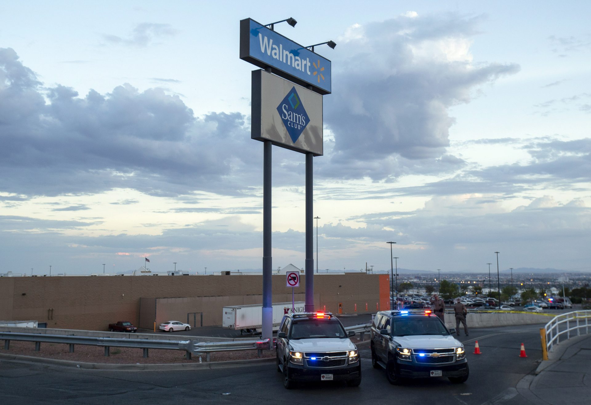 Texas state police cars block the access to the Walmart store in the aftermath of a mass shooting in El Paso, Texas, Saturday, Aug. 3, 2019.
