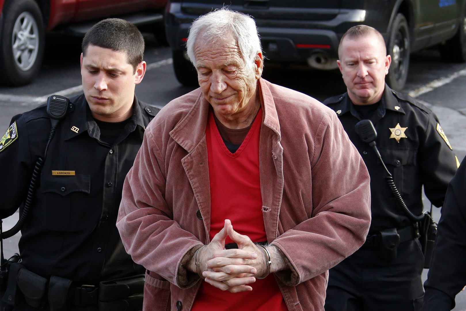 FILE PHOTO: In this Oct. 29, 2015 file photo, former Penn State University assistant football coach Jerry Sandusky, center, arrives at the Centre County Courthouse for a hearing about his appeal on his child sex-abuse conviction, in Bellefonte, Pa.