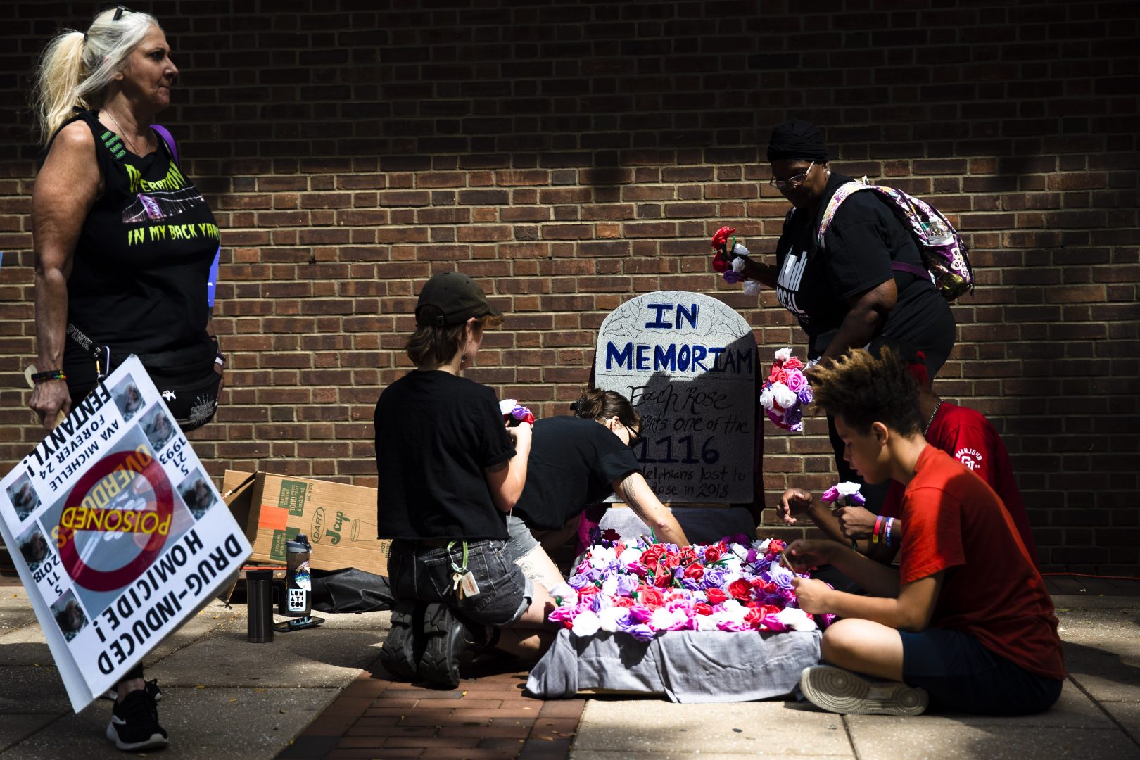 Protesters assemble a makeshift memorial to those lost to drug overdoses last year during a demonstration in support of a proposed supervised injection site, outside the federal courthouse in Philadelphia, Thursday, Sept. 5, 2019.   U.S. Attorney William McSwain believes the plan to open a supervised injection site violates the federal Controlled Substances Act and wants a federal judge to declare it illegal before it opens.  