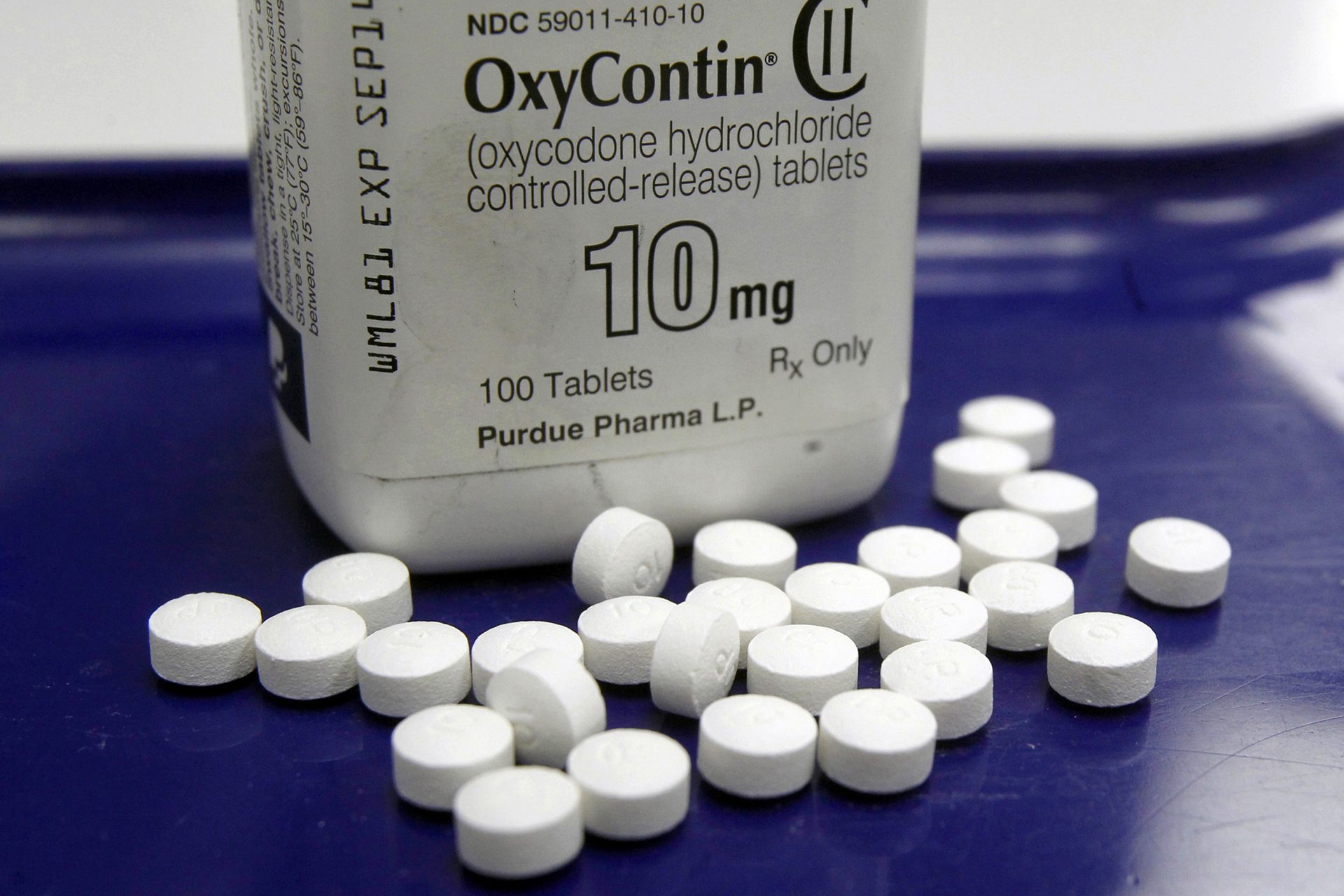 This Feb. 19, 2013, file photo shows OxyContin pills arranged for a photo at a pharmacy in Montpelier, Vt.