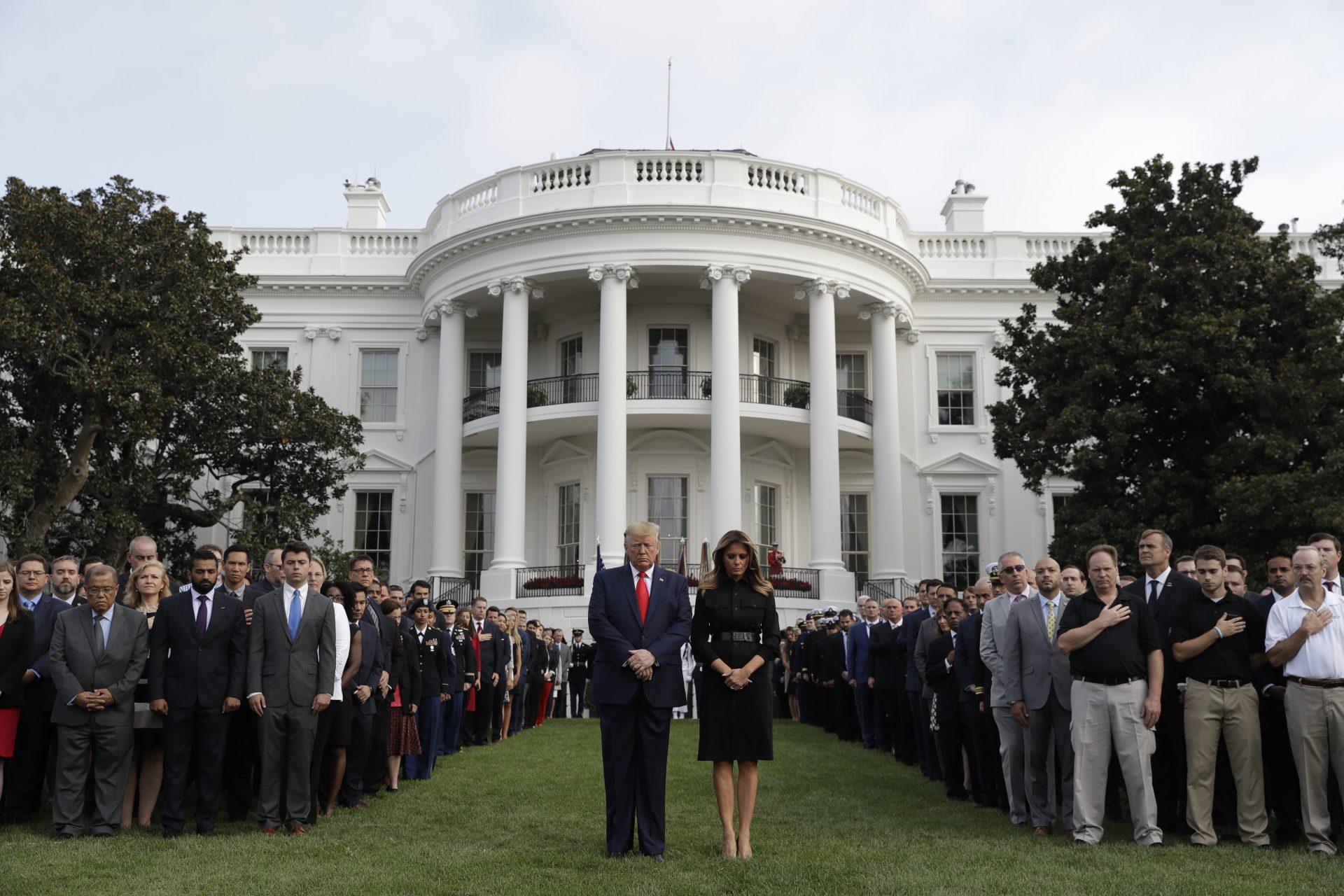 President Donald Trump and first lady Melania Trump participate in a moment of silence honoring the victims of the Sept. 11 terrorist attacks, on the South Lawn of the White House, Wednesday, Sept. 11, 2019, in Washington.