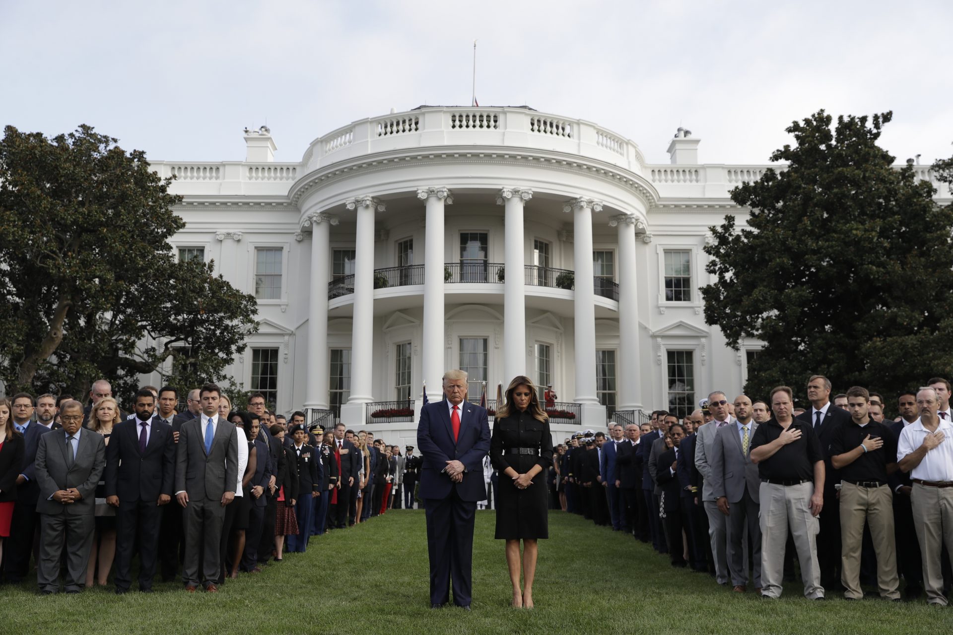 President Donald Trump and first lady Melania Trump participate in a moment of silence honoring the victims of the Sept. 11 terrorist attacks, on the South Lawn of the White House, Wednesday, Sept. 11, 2019, in Washington.