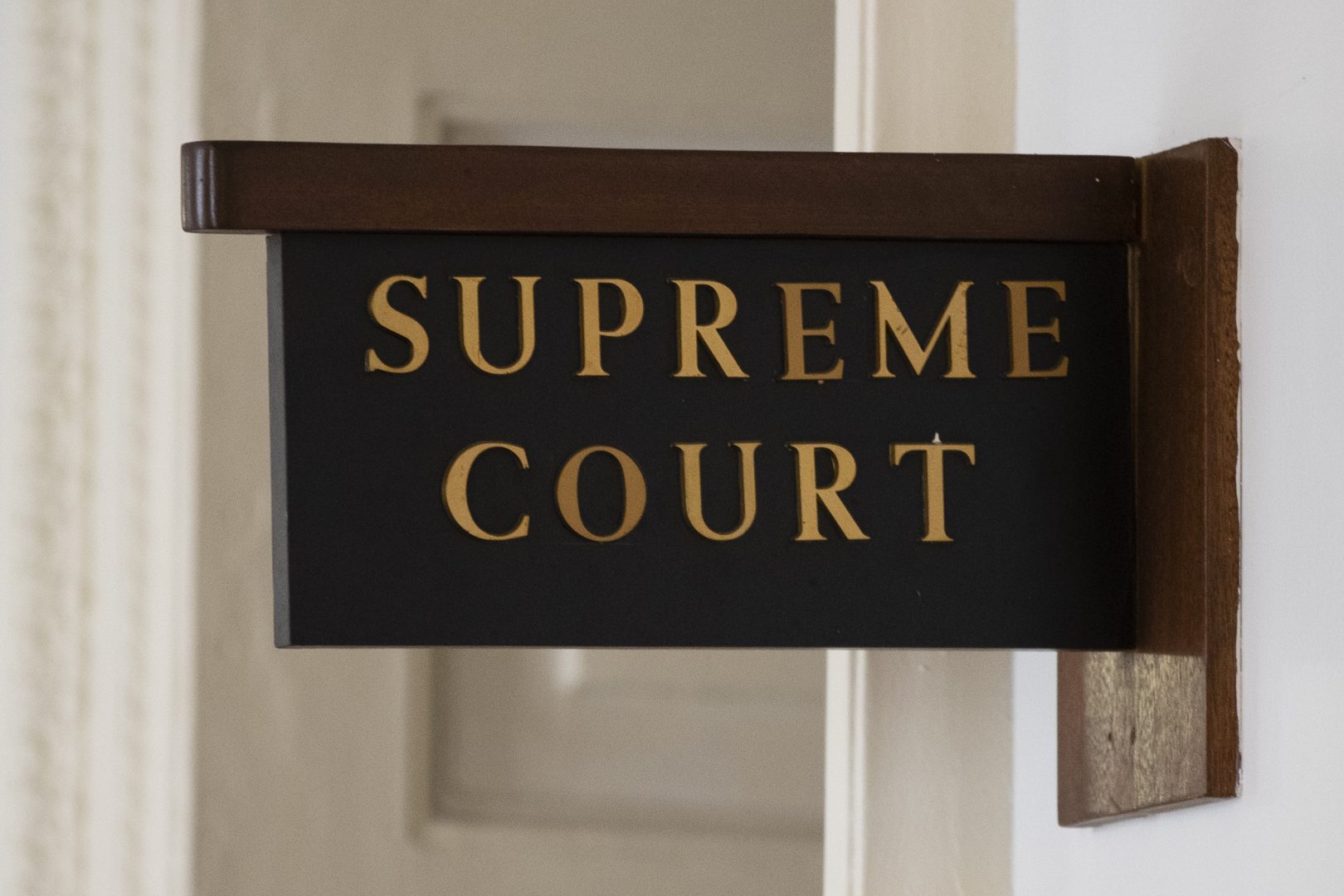 The sign for the Pennsylvania Supreme Court is posted by its door at City Hall in Philadelphia, Wednesday, Sept. 11, 2019.
