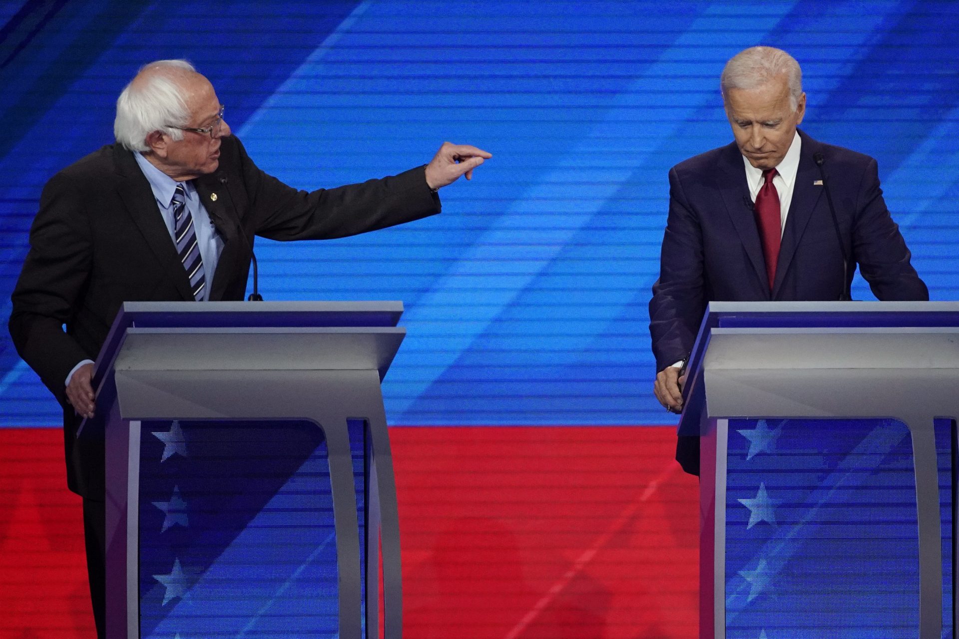 Sen. Bernie Sanders, I-Vt., left, speaks as former Vice President Joe Biden, right, listens Thursday, Sept. 12, 2019, during a Democratic presidential primary debate hosted by ABC at Texas Southern University in Houston.
