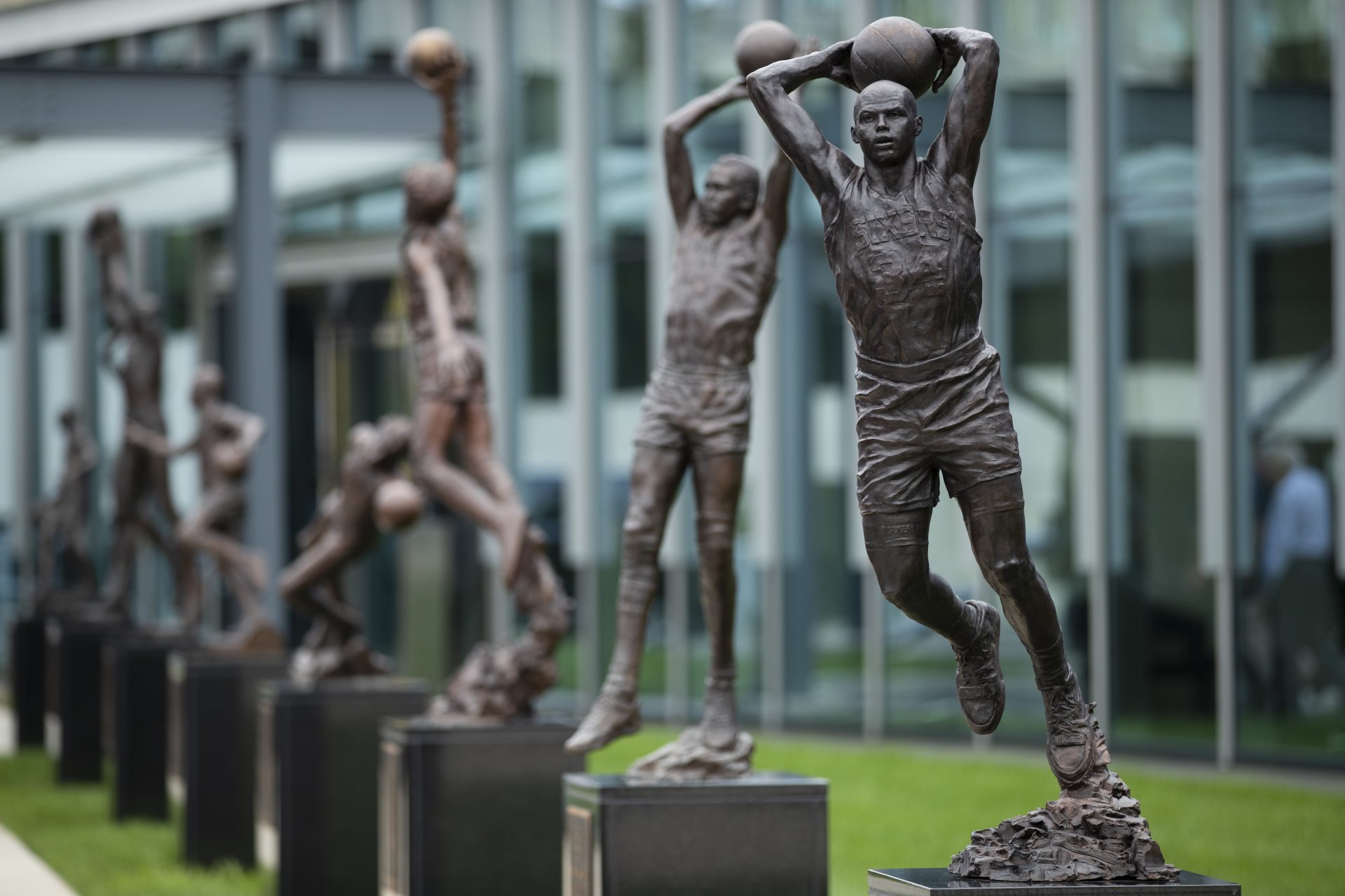 A sculpture honoring Charles Barkley, right, is shown after an unveiling at the Philadelphia 76ers NBA basketball training facility in Camden, N.J., Friday, Sept. 13, 2019. Barkley spent the first eight seasons of his storied career with Philadelphia after the 76ers chose him with the No. 5 overall pick in the 1984 NBA Draft. (AP Photo/Matt Rourke)