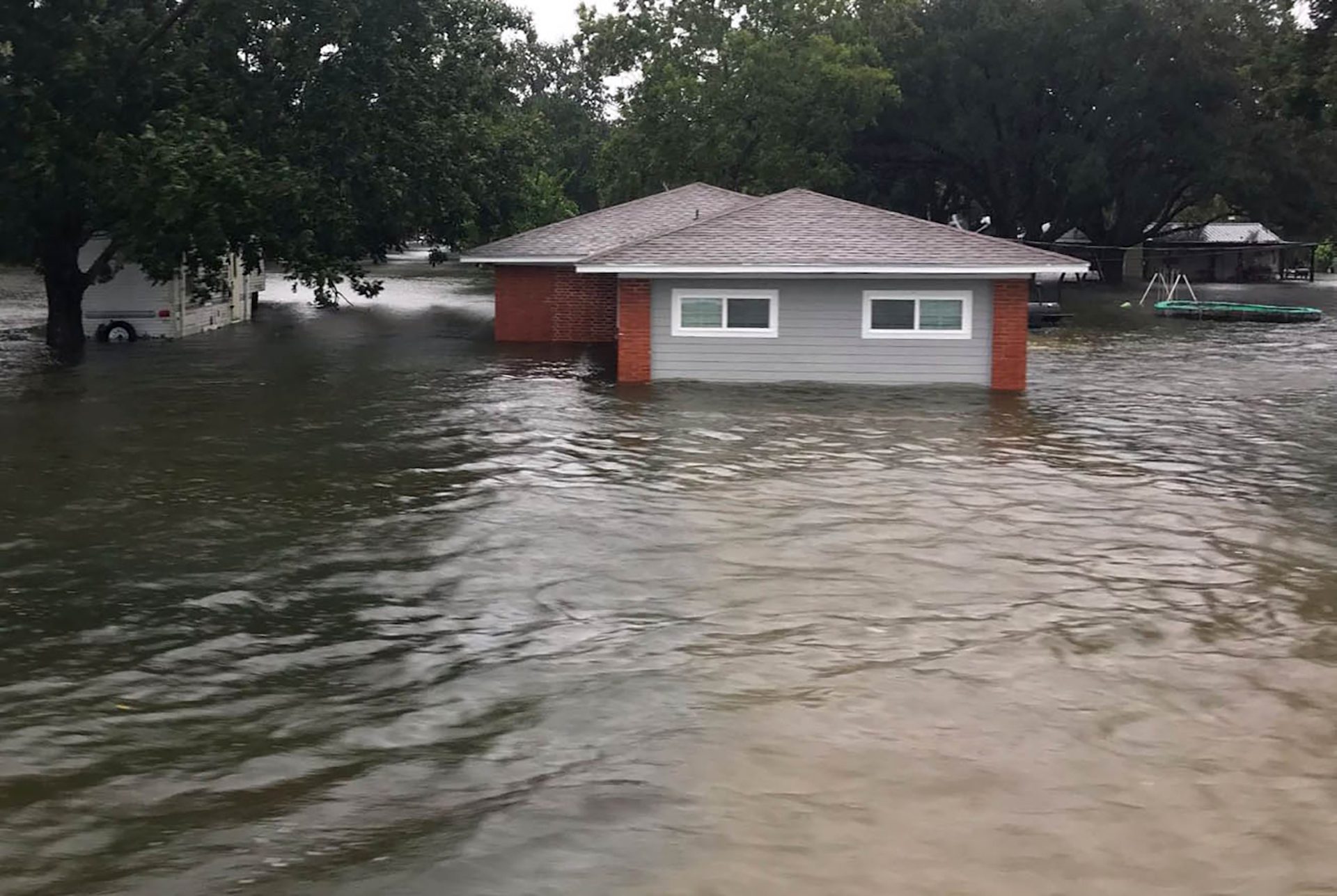 In this Sept.19, 2019, photo provided by the Chambers County Sheriff's Office, a flooded home is shown in Winnie, Texas. The area has experienced heavy flooding due to Tropical Depression Imelda.