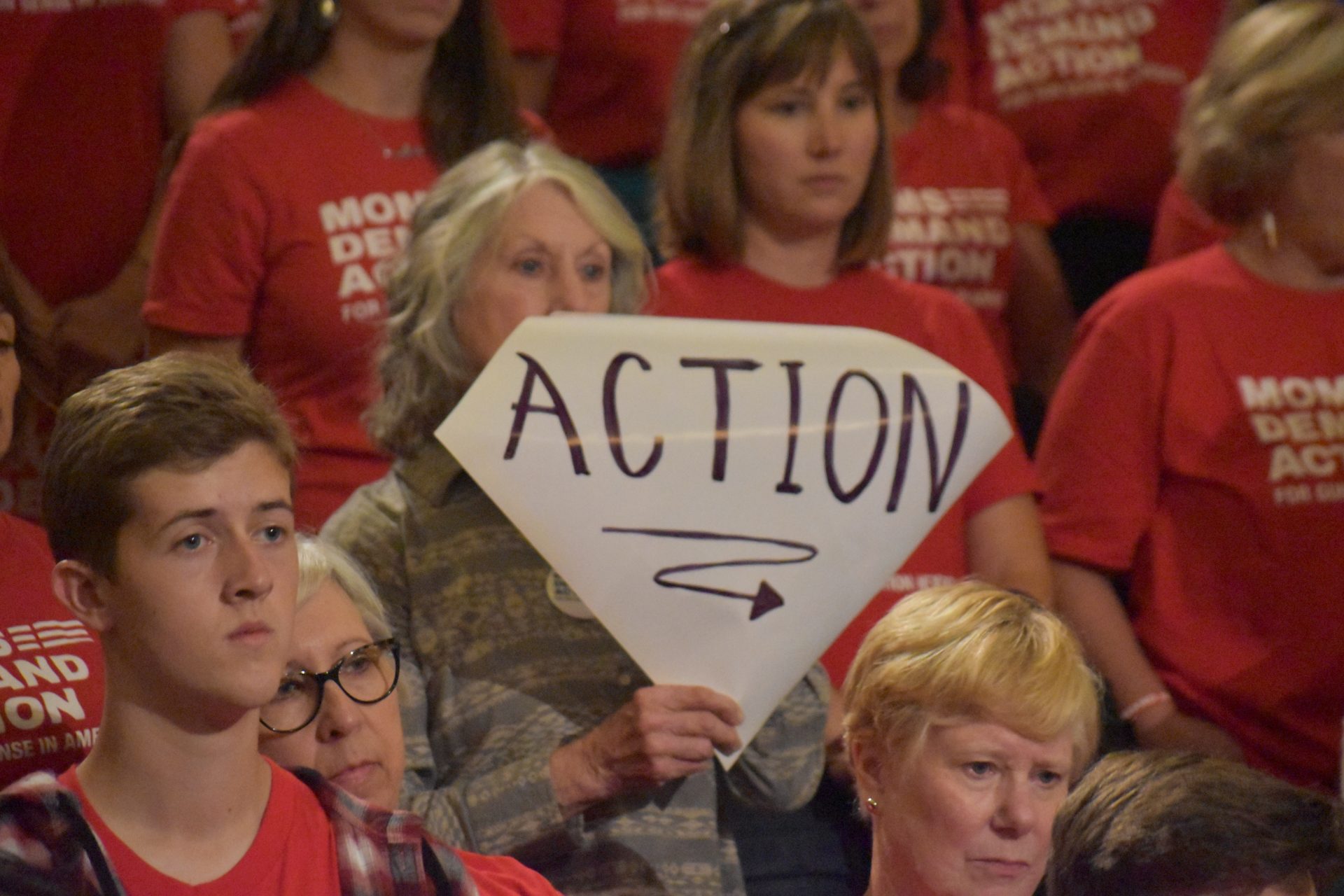 A sign reads "ACTION" during a rally in support of extreme risk protection orders in Harrisburg on Sept. 17, 2019 in the Pennsylvania Capitol.