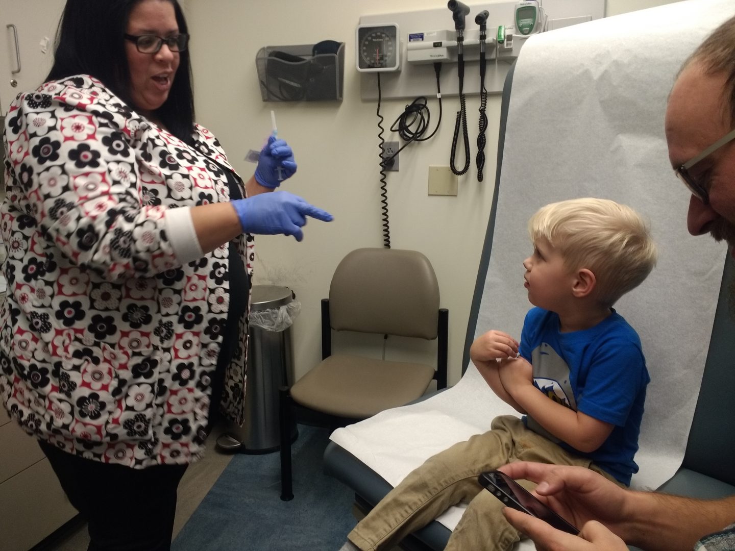 Shark Snider, age 3, waits for a flu shot at the Squirrel Hill Health Center in Pittsburgh.