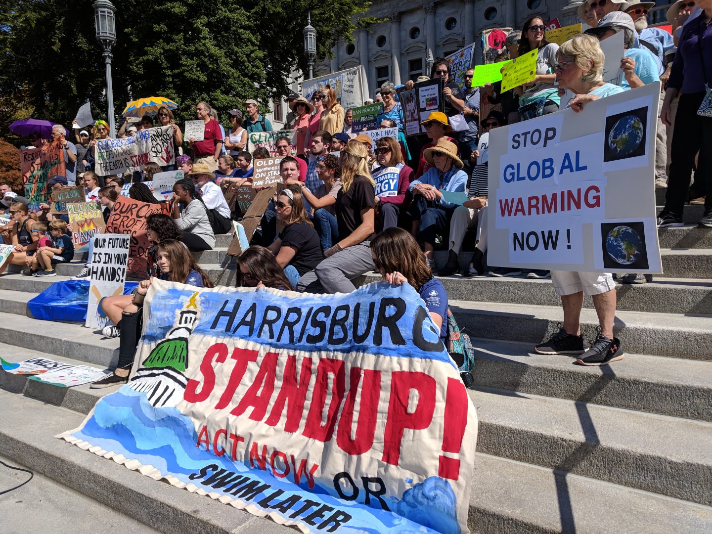 Demonstrators gather on the steps of the state capitol in Harrisburg to demand action on climate change on Friday, September 20, 2019. 