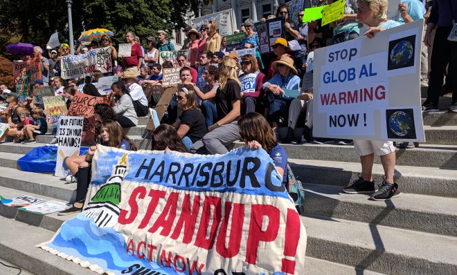 Demonstrators gather on the steps of the state capitol in Harrisburg to demand action on climate change on Friday, September 20, 2019. 