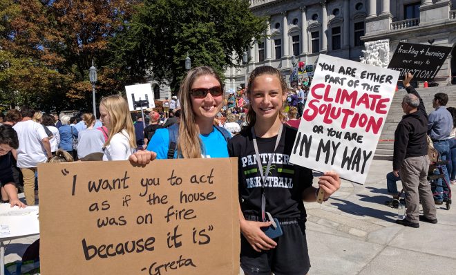 Lucy Brennan, 12, of Hershey (right) and her aunt Ren Englum pose for a photo at the Harrisburg Climate Strike on Friday, September 20, 2019. 