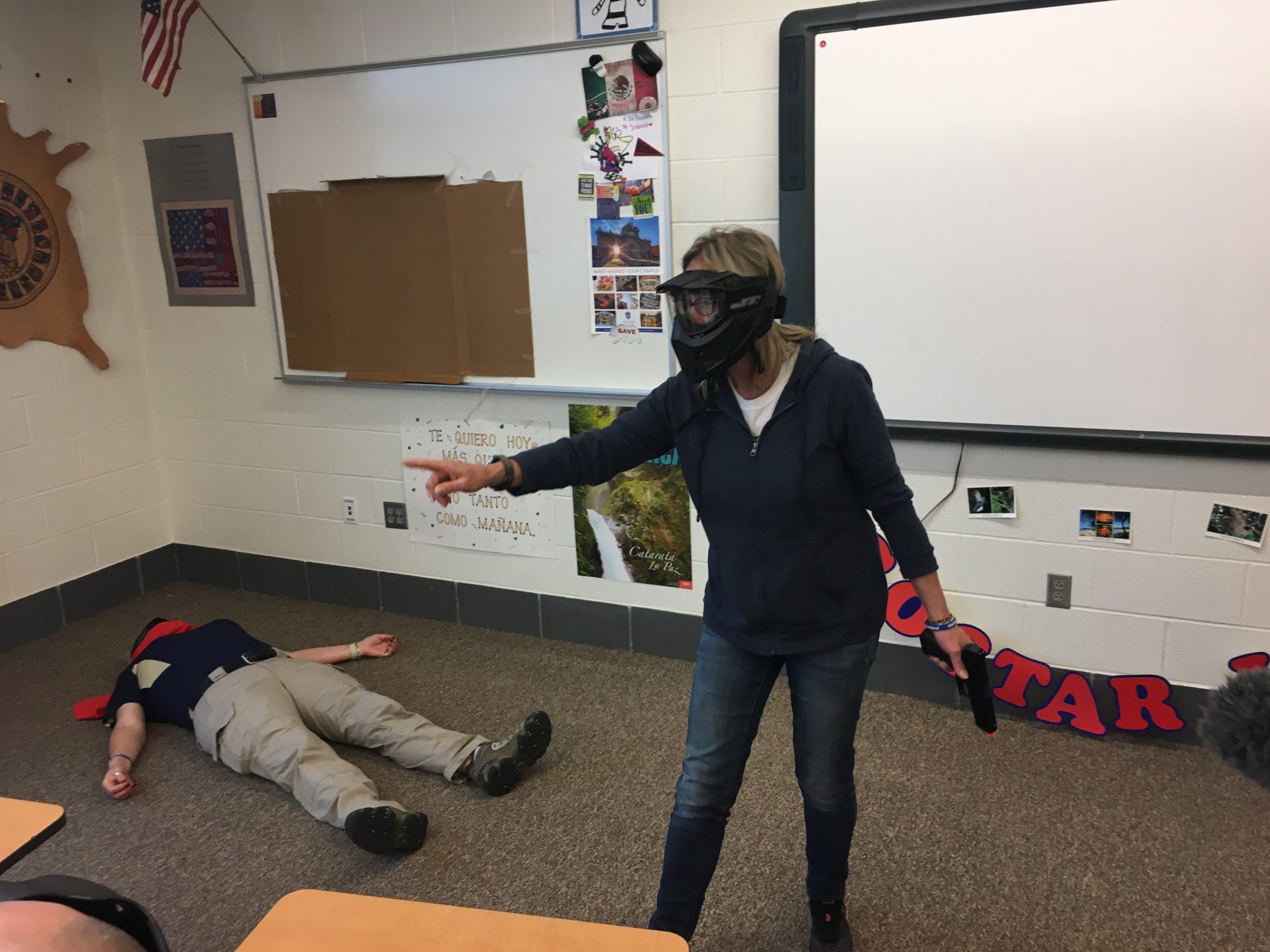 Angie directs students during a shooting simulation.