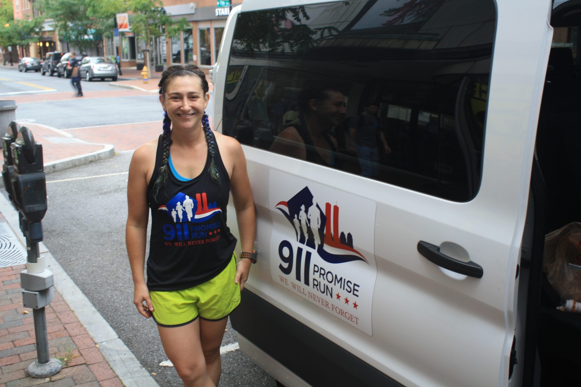 Dani Sevel of Virginia takes a break from the 9/11 Promise Run in downtown Wilmington Tuesday morning. Sevel and her team will run 243 miles from the Pentagon to Ground Zero in New York City by Wednesday.